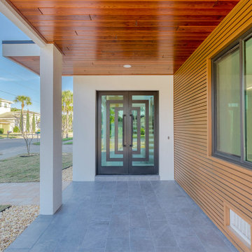 Inviting Modern Entrance Framed in Warm Wood and Glass