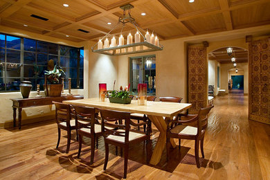 Eclectic dining room in Santa Barbara with beige walls and medium hardwood floors.