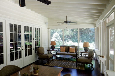 Design ideas for a mid-sized traditional backyard screened-in verandah in Atlanta with a roof extension.