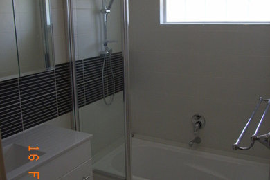This is an example of a small traditional kids bathroom in Perth with white cabinets.