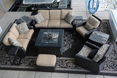 Inspiration for a mid-sized transitional backyard tile patio remodel in Other