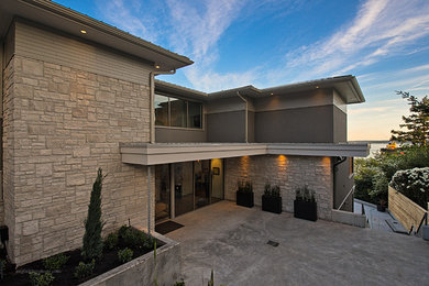 Example of a trendy gray mixed siding exterior home design in Vancouver