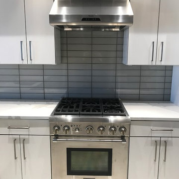 Seaport Condo Gut Renovationglass backsplash tile installed this week, the last