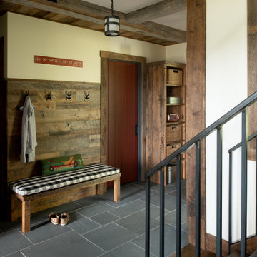 Reclaimed Wood Paneling, Cabinetry, and Timbers in Rustic Dream Cabin Mudroom