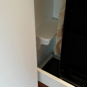 White Murphy Bed with pivoting bookcases