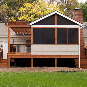Lamping - Cedar deck in Kansas City with screened in porch.