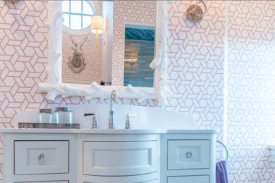 Alcove shower - mid-sized transitional 3/4 white tile and marble tile alcove shower idea in Boston with beaded inset cabinets, white cabinets, multicolored walls, an undermount sink, quartz countertops and a hinged shower door