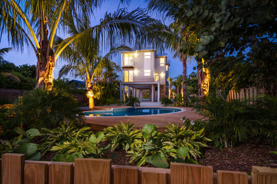 Mid-sized contemporary gray two-story mixed siding gable roof idea in Tampa