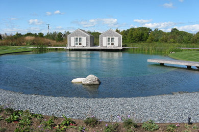 Inspiration for a huge traditional backyard water fountain landscape in Boston.