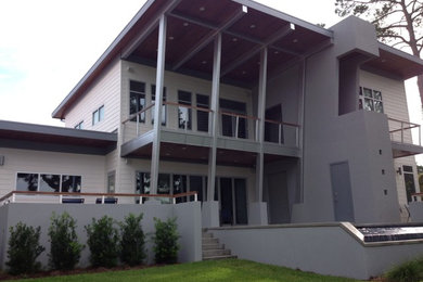 Large modern two-story exterior home idea in Miami