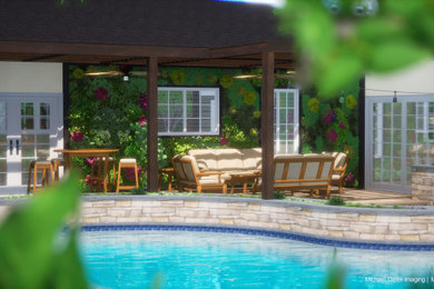Imagen de piscina tropical tipo riñón en patio trasero con paisajismo de piscina y suelo de hormigón estampado