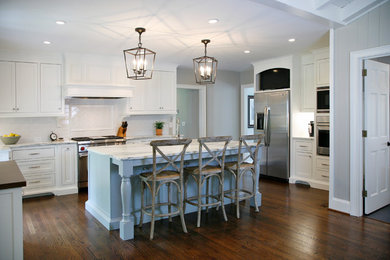Inspiration for a large country u-shaped eat-in kitchen in Atlanta with recessed-panel cabinets, white cabinets, marble benchtops, white splashback, ceramic splashback, stainless steel appliances, dark hardwood floors and with island.
