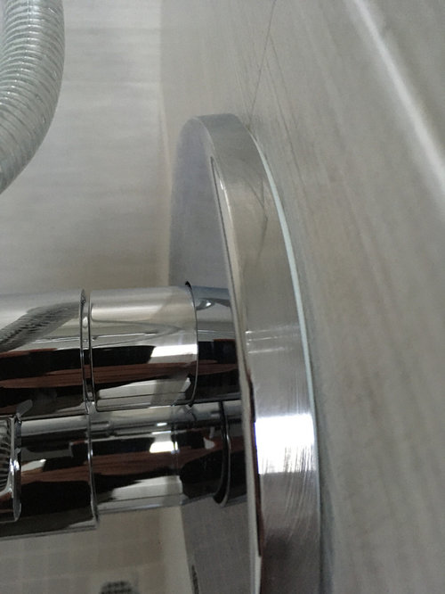 Shower faceplate not flush with tile