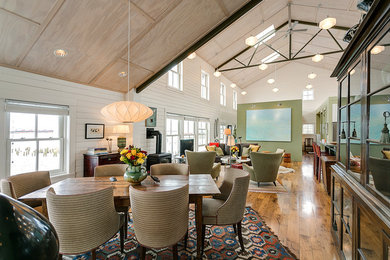Great room - mid-sized transitional medium tone wood floor great room idea in Portland with white walls and no fireplace
