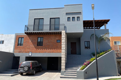 Modern gray two-story house exterior idea in Other