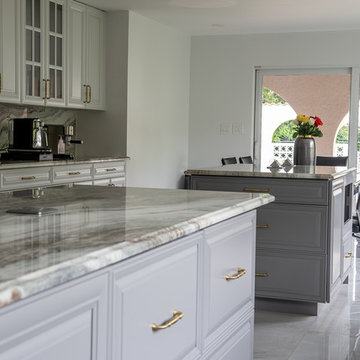 Transitional Kitchen Done in a 2 Tone Color With Integrated Dining Table