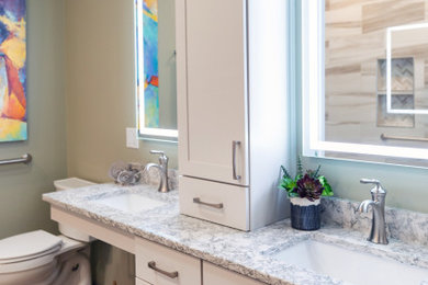 Mid-sized trendy 3/4 brown tile and porcelain tile terra-cotta tile, brown floor and double-sink bathroom photo in Other with flat-panel cabinets, white cabinets, a two-piece toilet, green walls, an undermount sink, quartz countertops, beige countertops and a built-in vanity