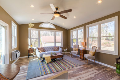 Small elegant dark wood floor and brown floor sunroom photo in DC Metro with a standard ceiling