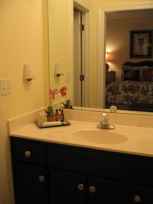 Newly painted black vanity with Anthropologie knobs