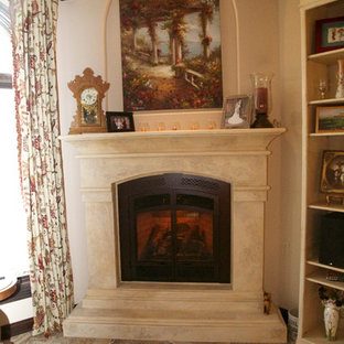 Inspiration for a mediterranean living room in Little Rock with a hanging fireplace.