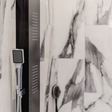 Bathroom remodeling in Columbia, MD with double vanity & marble bathtub