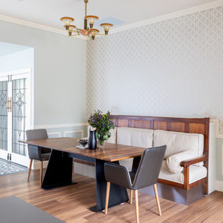 Inspiration for a contemporary dining room in Adelaide with grey walls, medium hardwood floors, brown floor, decorative wall panelling and wallpaper.