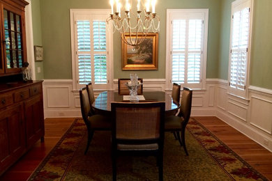 This is an example of a large transitional kitchen/dining combo in Jacksonville with green walls, medium hardwood floors and no fireplace.