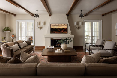 Large tuscan enclosed dark wood floor, brown floor and exposed beam living room photo in New York with beige walls, a standard fireplace, a concrete fireplace and a wall-mounted tv
