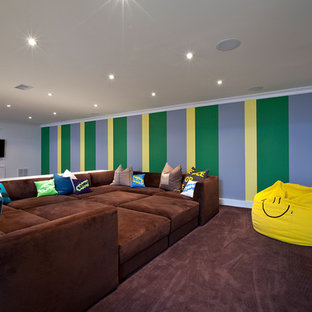 Photo of a contemporary basement in New York with multi-coloured walls and carpet.
