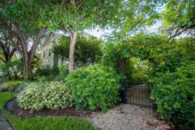 This is an example of a tropical shade front yard gravel garden path in Miami.