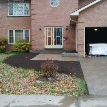New front veranda, garden bed, walkway, re-lay driveway