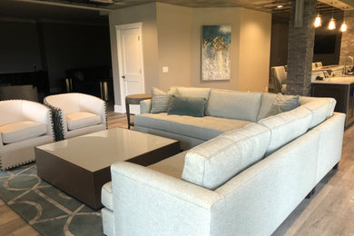 Basement - mid-sized transitional walk-out vinyl floor basement idea in Other with gray walls