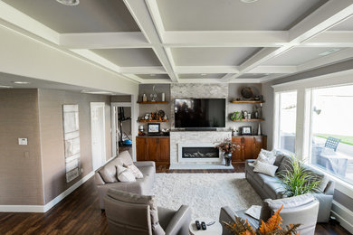 Family room - contemporary open concept dark wood floor and brown floor family room idea in Seattle with gray walls, a standard fireplace, a tile fireplace and a wall-mounted tv