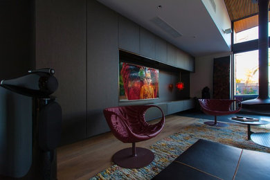 This is an example of a contemporary family room in Melbourne.