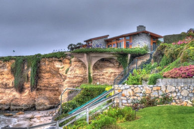 Trendy one-story stone house exterior photo in Orange County