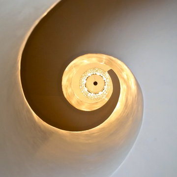 Pearlized shell Venetian plaster finish on stairwell walls.