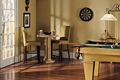 Example of a mid-sized open concept medium tone wood floor game room design in Dallas with white walls