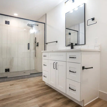 Black-Framed Glass Shower with Bench and White Vanity – Beacon Hill Seattle