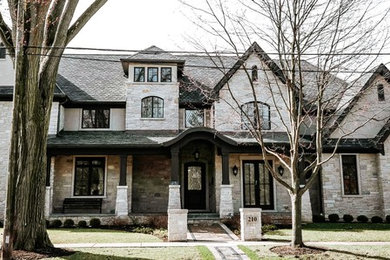Large transitional brick exterior home photo in Chicago