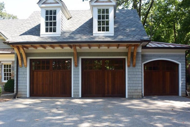 Inspiration for a transitional three-car garage remodel in Atlanta