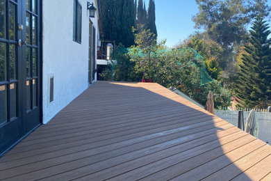 Inspiration for a large backyard second story privacy deck remodel in San Diego