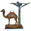 Camel Standing Under A Palm Tree Bronze Statue - Size: 20"L x 29"W x 25"H.