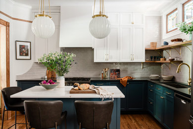 Example of a mid-sized transitional l-shaped medium tone wood floor and brown floor eat-in kitchen design in Chicago with a single-bowl sink, recessed-panel cabinets, white cabinets, quartz countertops, beige backsplash, porcelain backsplash, stainless steel appliances, an island and white countertops