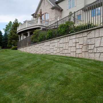 Stone retaining wall with aluminum fencing