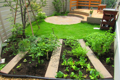 Country courtyard garden in Other with a vegetable garden.