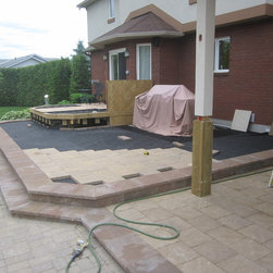 Second level of deck being stone cladded - Deck Tiles And Planks