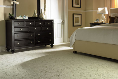 Mid-sized elegant master carpeted and beige floor bedroom photo in Houston with beige walls and no fireplace