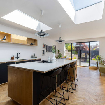 Sleek, modernised retro 70's open plan kitchen diner