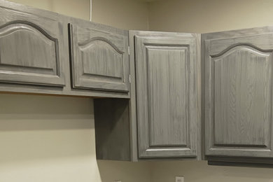 Inspiration for a contemporary l-shaped eat-in kitchen remodel in Portland with raised-panel cabinets and distressed cabinets