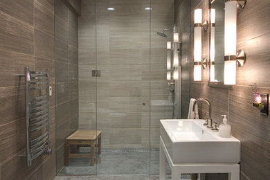 Trendy brown tile alcove shower photo in Grand Rapids with an integrated sink and white cabinets
